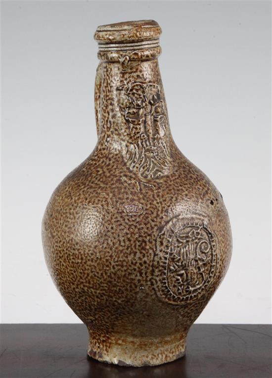 A German stoneware bellarmine jug, 16th / 17th century, 22cm.